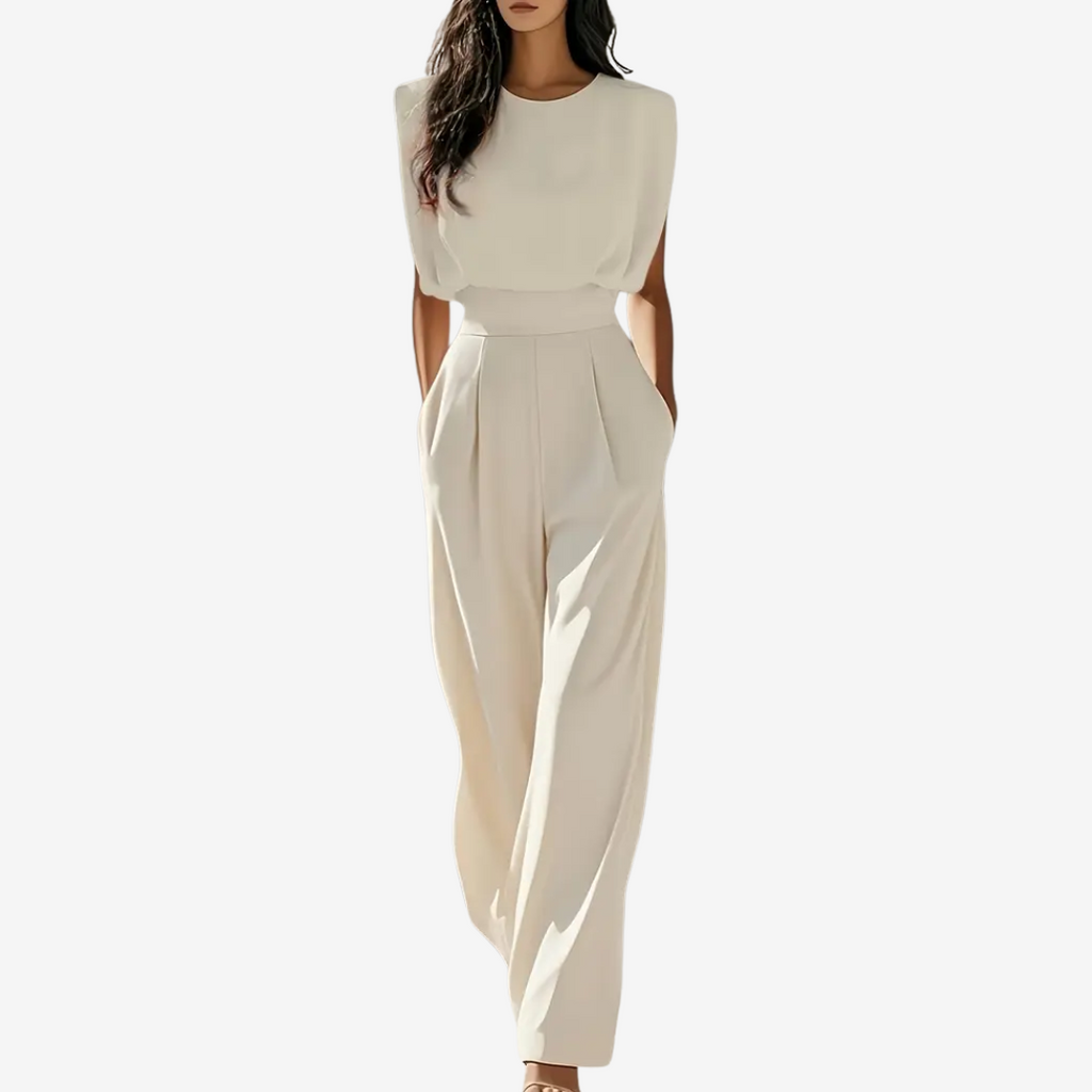 Woman wearing a beige jumpsuit on a white background