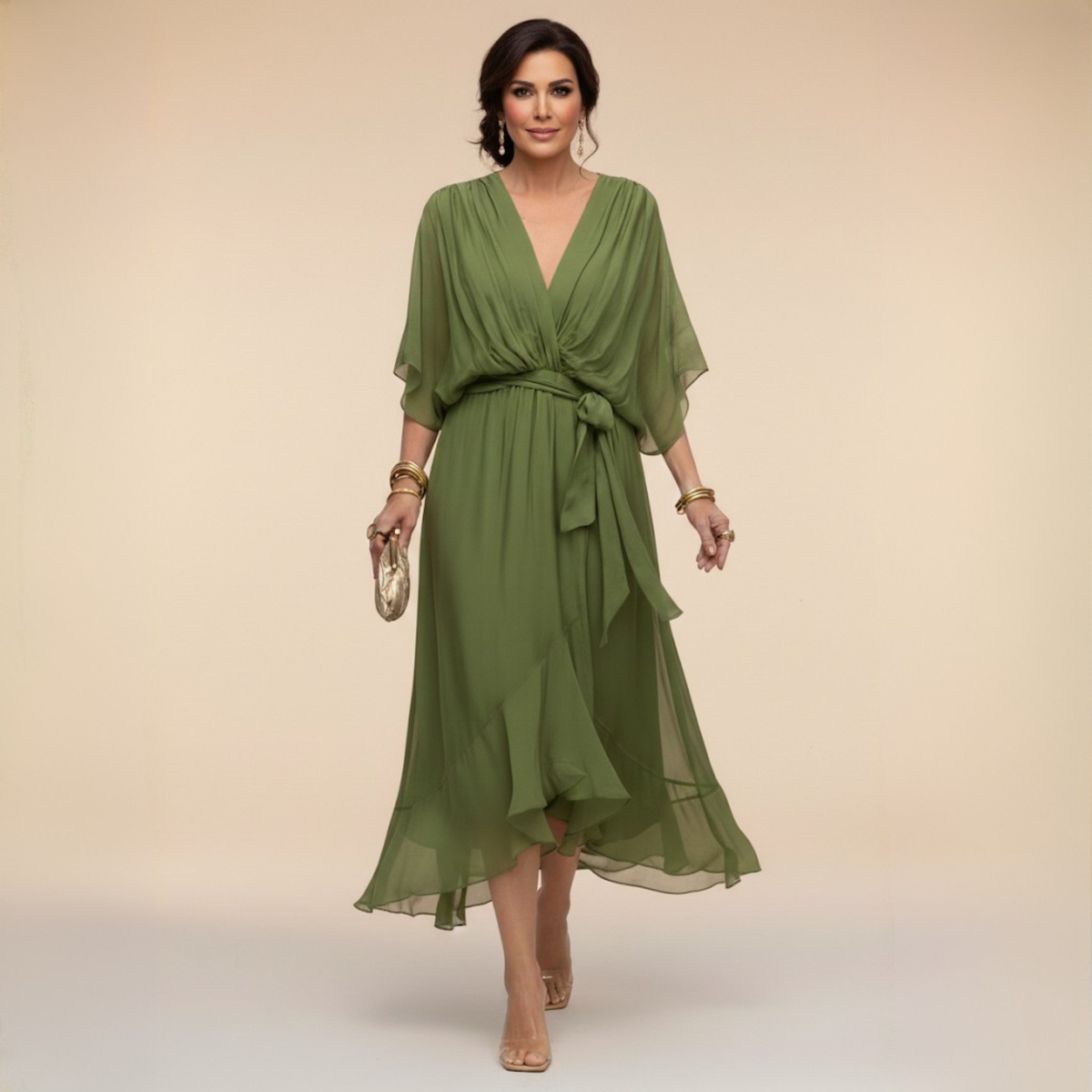 Woman wearing a green dress against a beige background