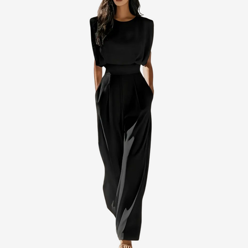 Black jumpsuit worn by a model on a white background