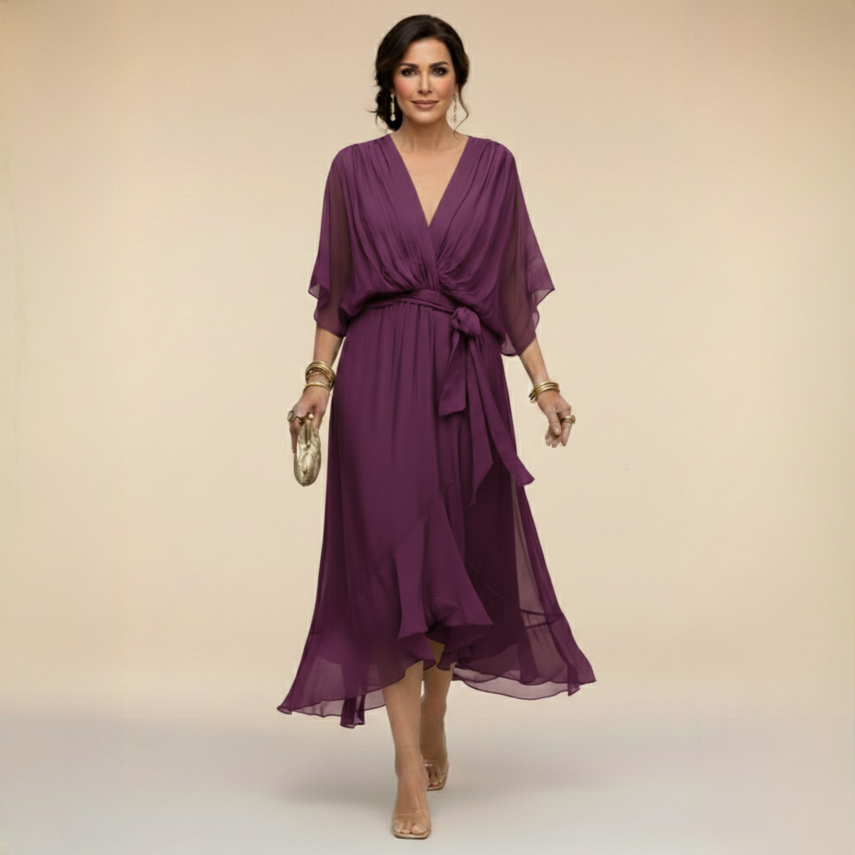 Woman wearing a purple dress against a beige background