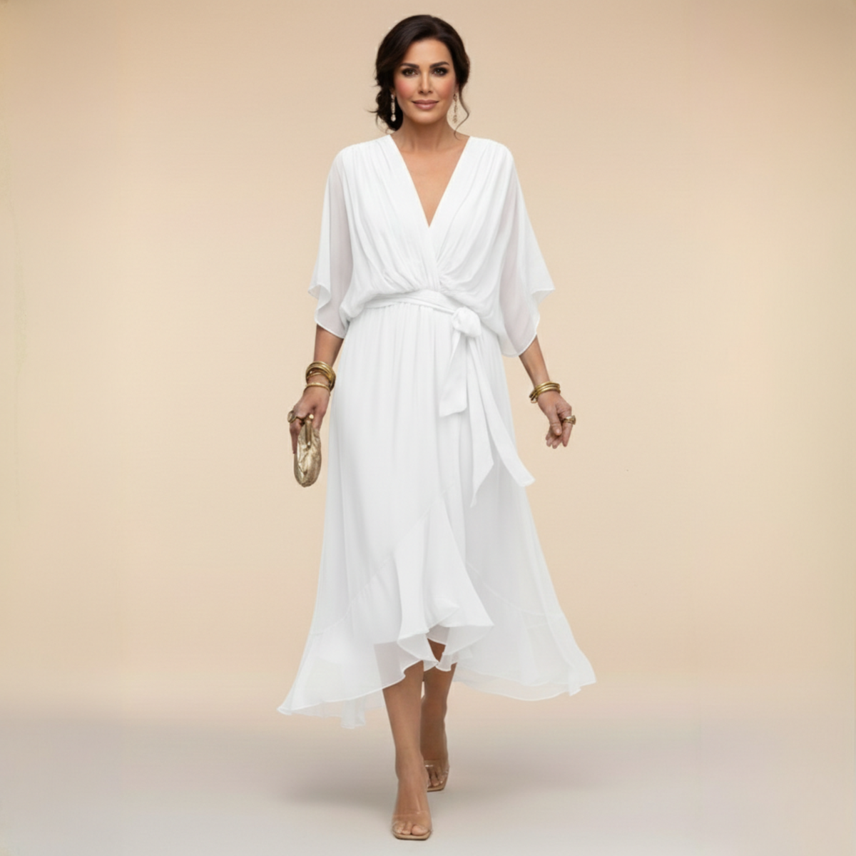 Woman wearing a white dress against a beige background