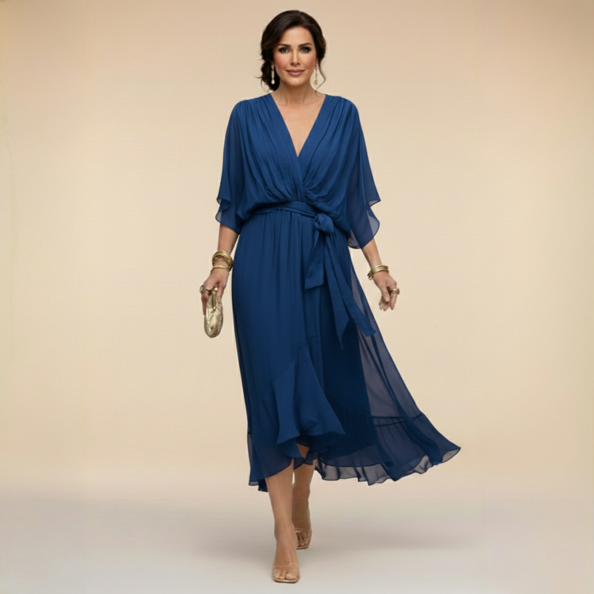 Woman wearing a blue dress against a beige background