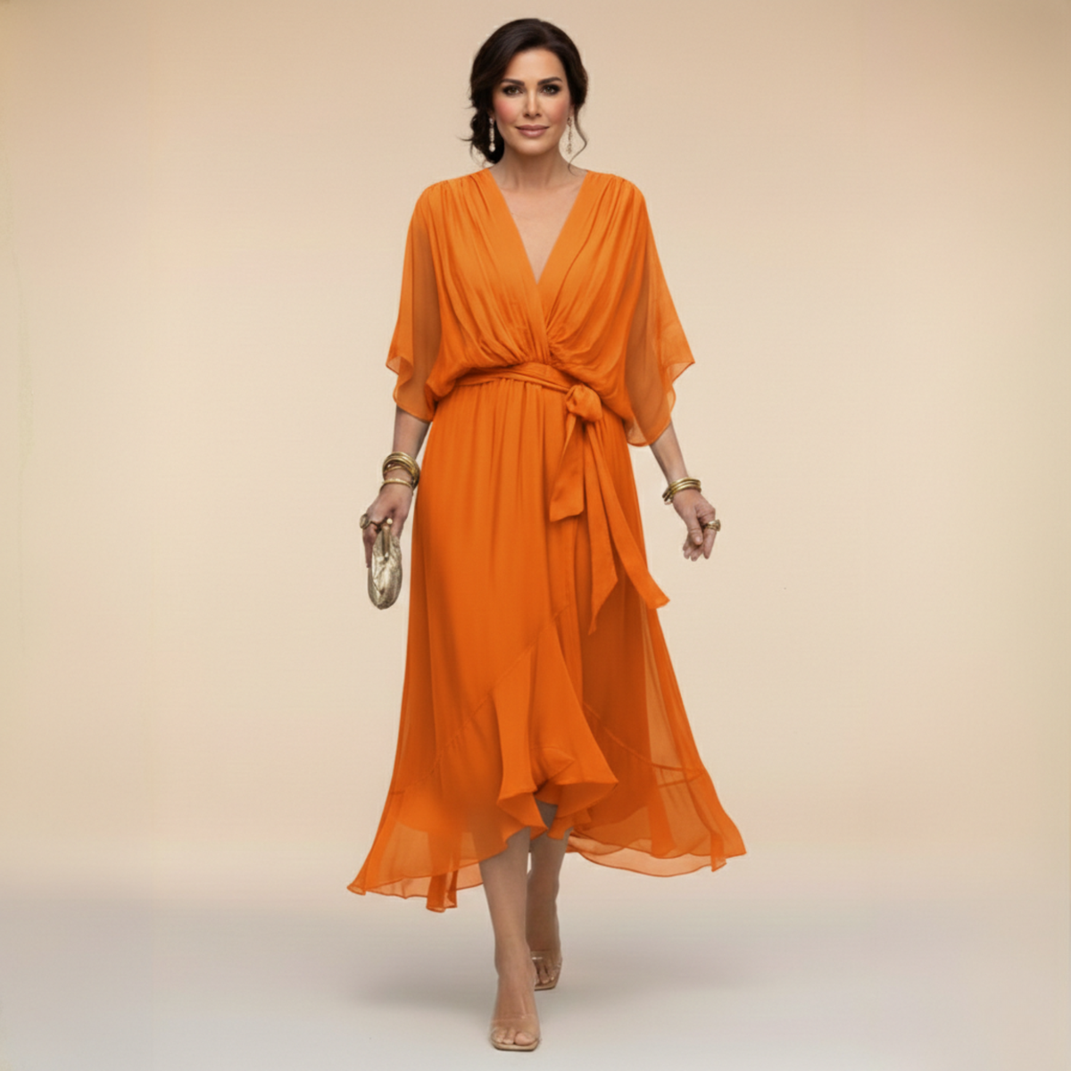 Woman wearing an orange dress against a beige background